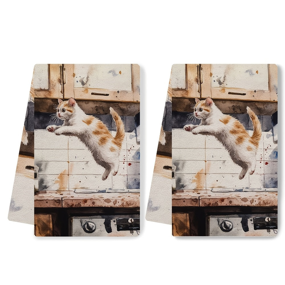 Two pieces of incredibly soft kitchen towels featuring a playful kitten leaping design. These highly absorbent and machine washable dish hand towels are perfect for your contemporary style kitchen. Each towel measures 40.64x60.96 cm and is ideal for