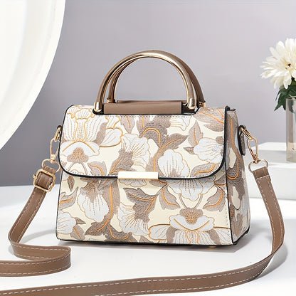 Large capacity floral embroidered crossbody bag with zipper closure and polyester lining. Versatile commuter handbag with luxurious, fashionable design and edge paint detail. Available in