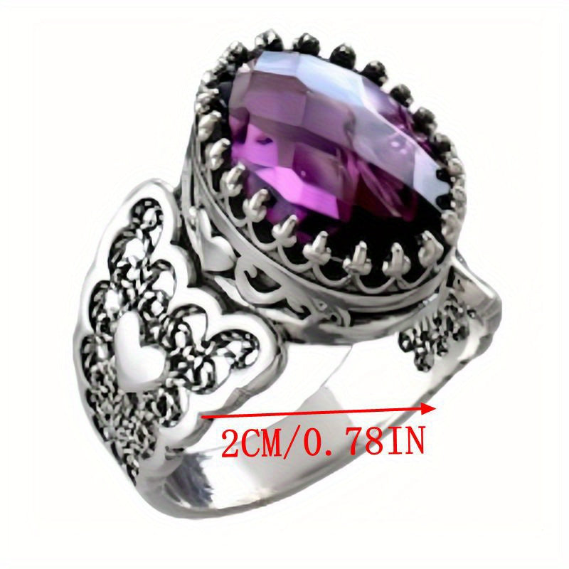 Handmade with care, this stunning cocktail ring features a detailed filigree art heart design and is crafted from 925 sterling silver. Adorned with a beautiful amethyst gemstone, this solid silver ring is perfect for everyday wear.