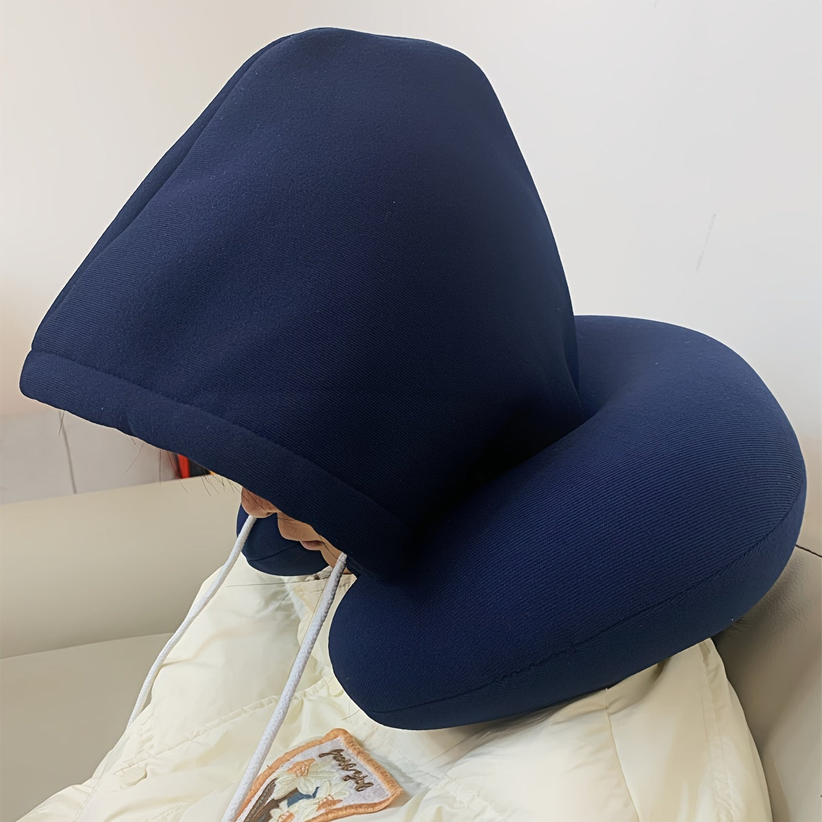 Travel in comfort with this versatile 1pc Particle Hooded U-shaped Neck Pillow, perfect for napping on airplanes.