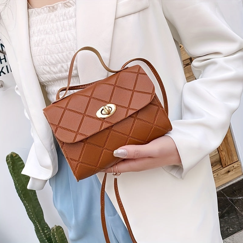 Stylish small square handbag with embossed design and quilted crossbody strap.