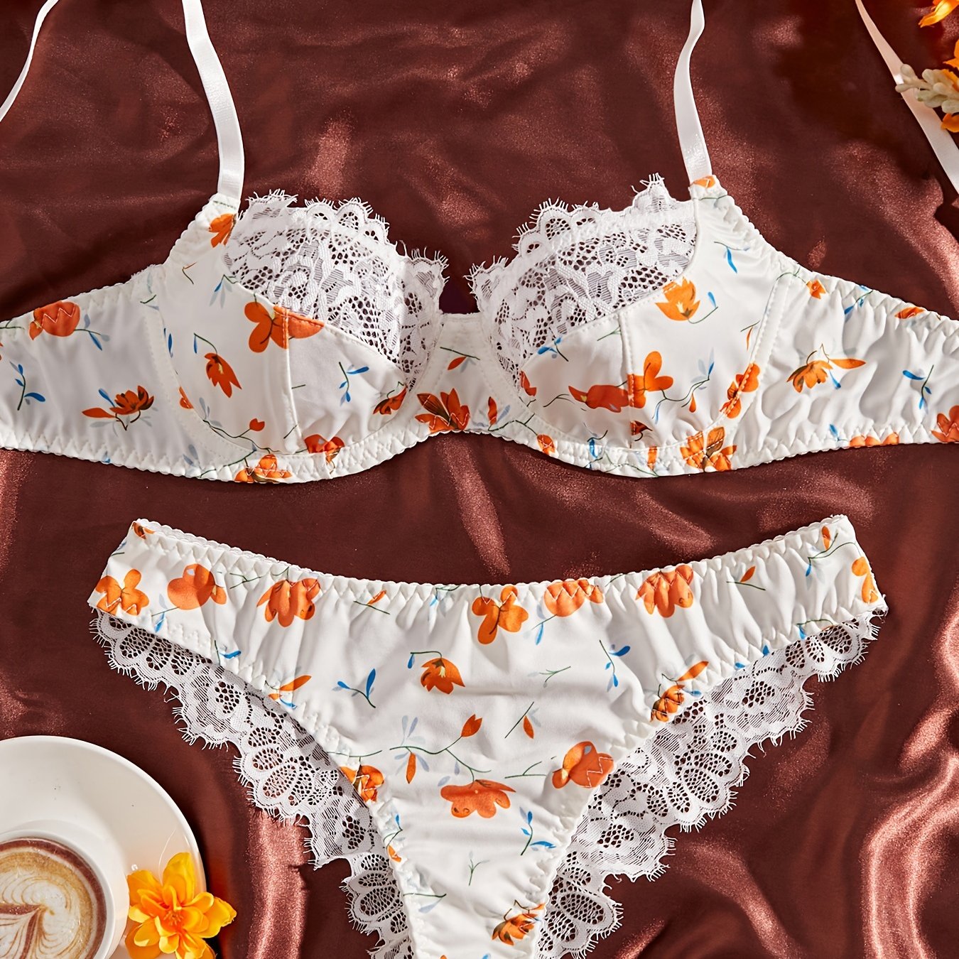 Stylish lace-trimmed floral print bra and panty set for women. Comfortable polyester blend, machine washable.