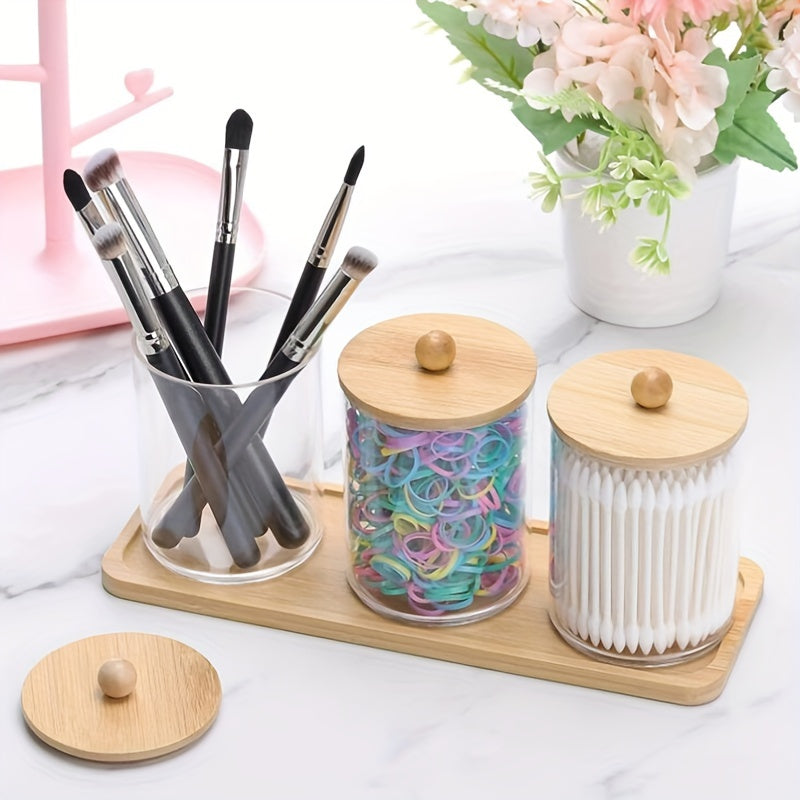 Set of 3 cotton swab/ball/pad holders with tray, apothecary jar with wood lids, and clear bathroom storage containers.