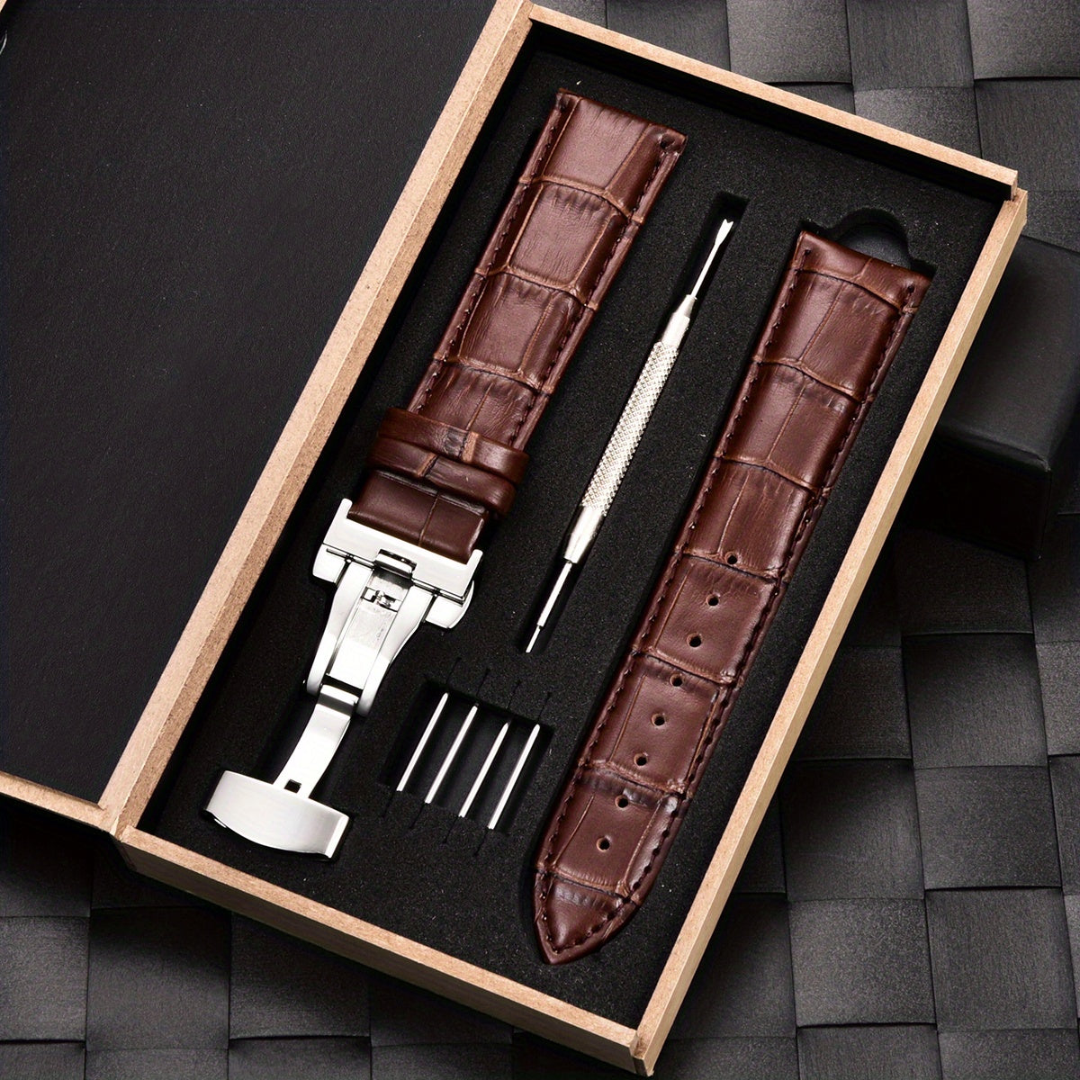 Watchband made of PU leather with stainless steel butterfly deployment buckle clasp, available in sizes 18mm, 20mm, 22mm, and 24mm, comes with a box.