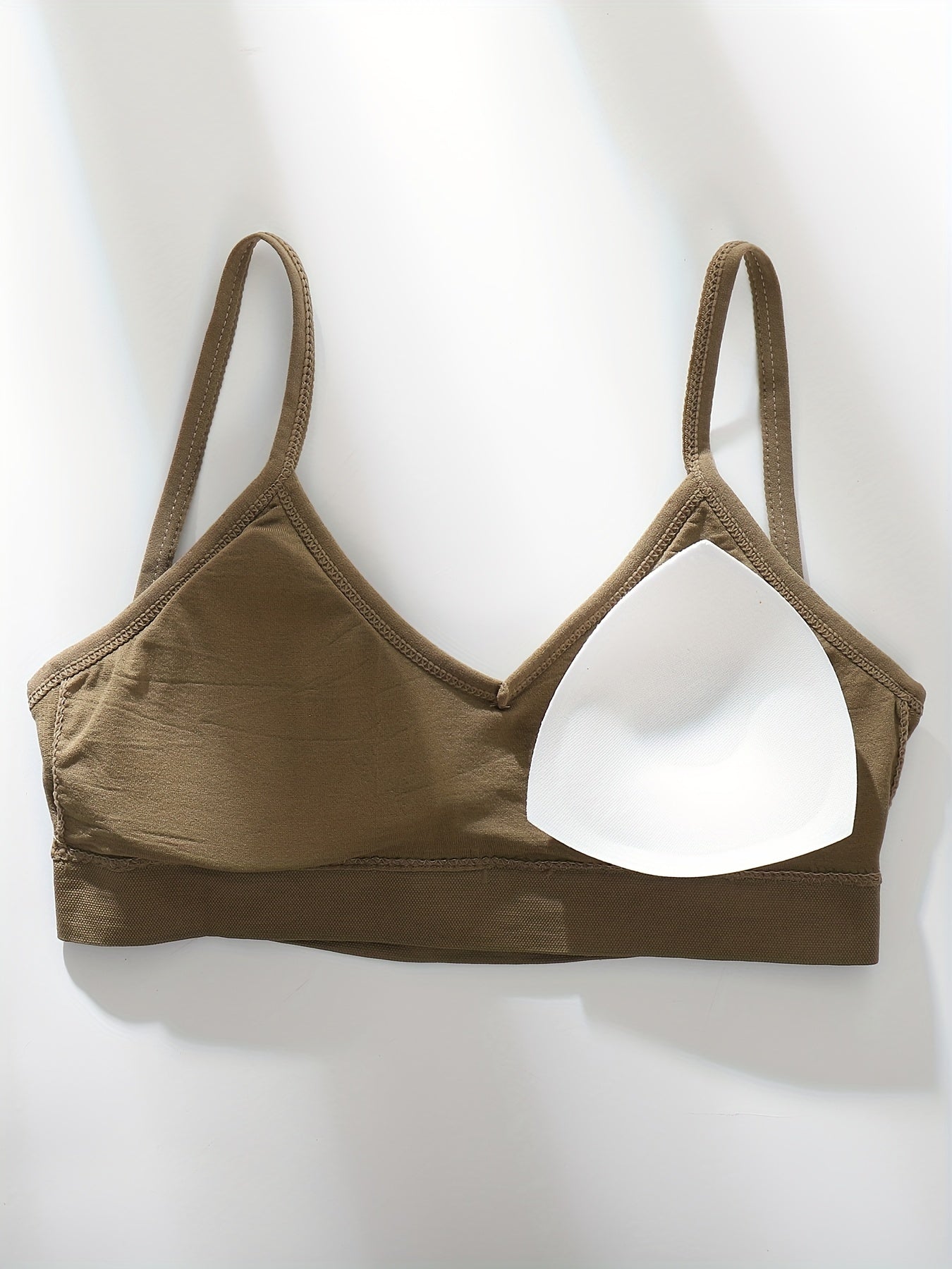 Four wireless bras made of solid ribbed material that are comfortable, breathable, and stretchy. Ideal for women looking for lingerie and underwear.