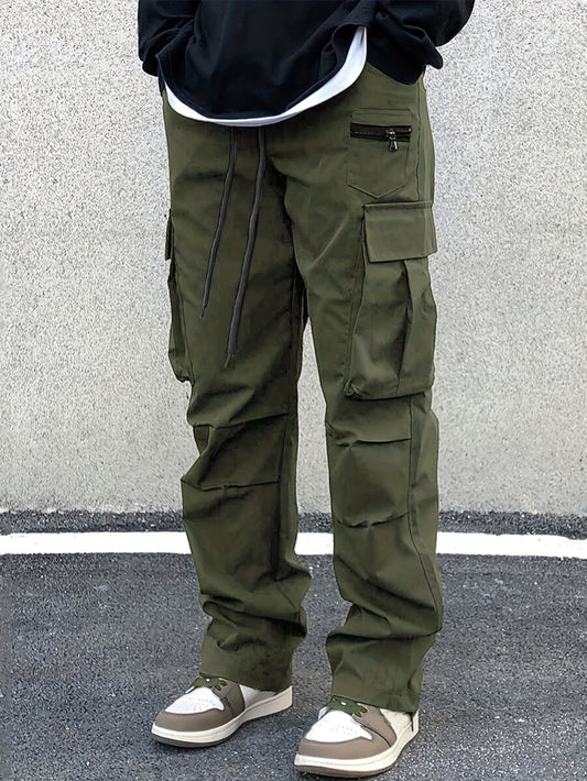 Plus size men's cargo pants in solid color with drawstring waist, multiple pockets, and woven material suitable for all seasons.