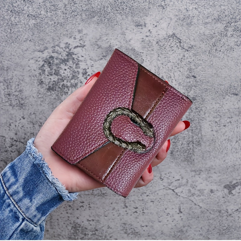 Vintage style women's slim wallet made of faux leather with buckle closure, tri-fold design, slip pocket, and faux leather lining.