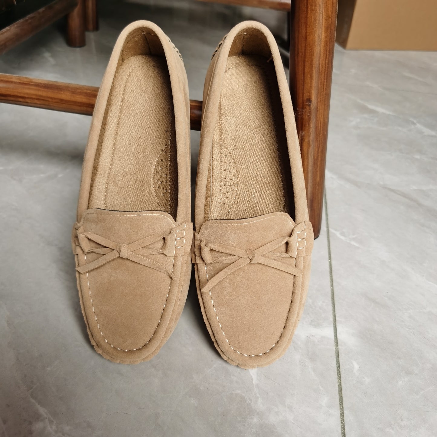 Retro flat loafers with bow detail, slip on style, and soft sole for casual wear.