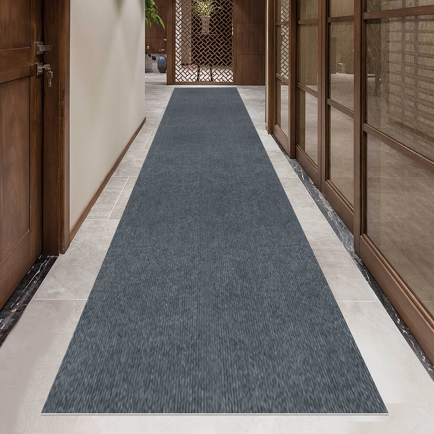 Add a touch of luxury with our Lightweight Dark Gray Striped Runner Mat. Made of non-slip, stain-resistant, and machine washable polyester, this mat is perfect for hallways, kitchens, living rooms, garages, and patios. Easy to install, it's the ideal mat