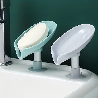 Suction cup soap dish with drainage for home organization and storage, suitable for kitchen and bathroom use.