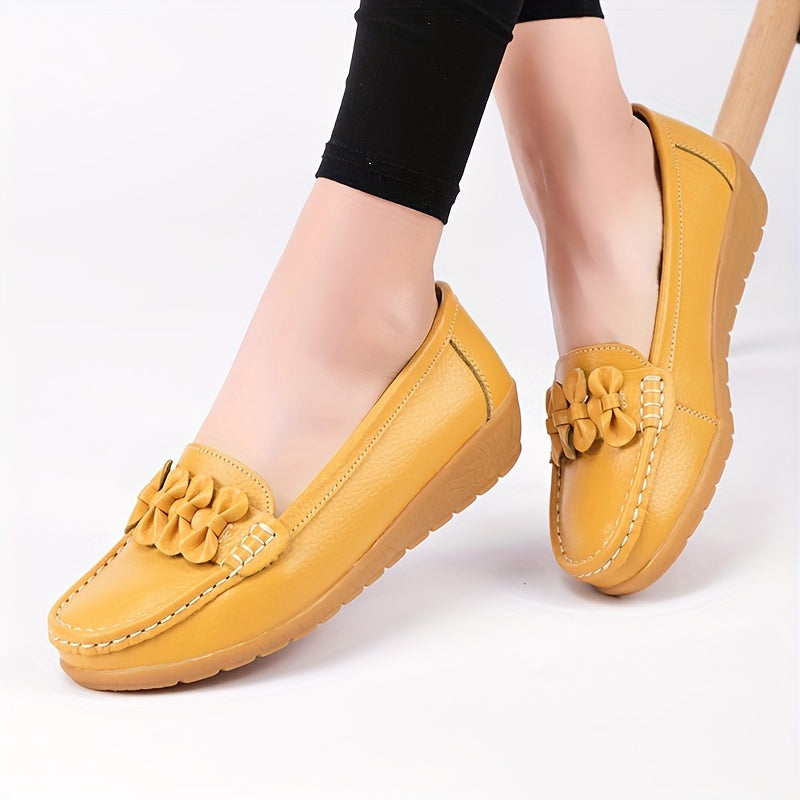 Women's flat shoes with bow detail, solid color, round toe, slip-on design for casual walking.