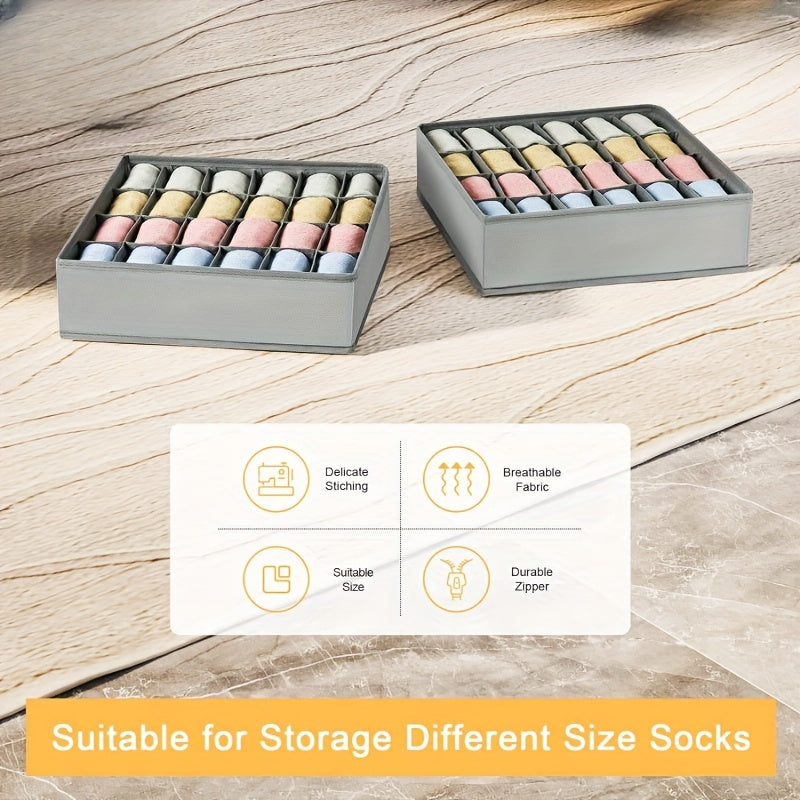 Pair of foldable organizers with 24 compartments for socks, underwear, bras, and ties. Made from breathable fabric with a durable zipper for versatile storage options. Can be used in the