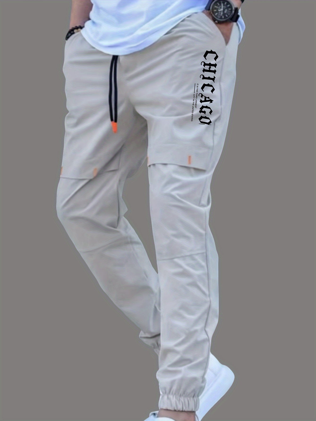 Men's casual joggers made of 100% polyester non-stretch woven fabric with alphabet print detail, suitable for all seasons and featuring a regular fit.