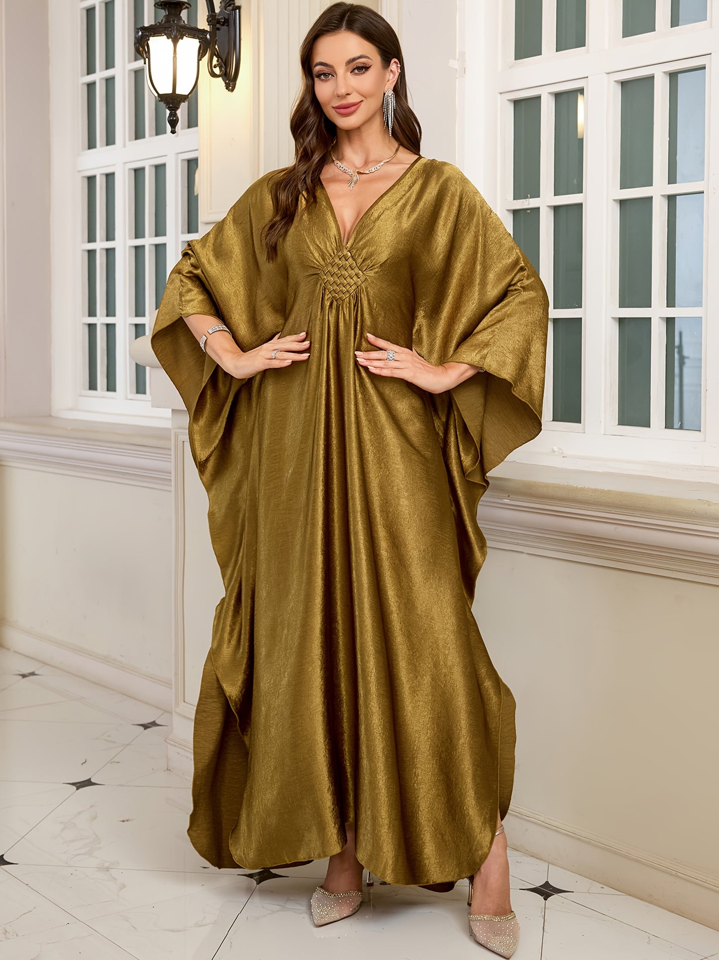 Stylish olive green V-neck kaftan dress with bat sleeves. Ideal as a beach cover-up or casual outerwear for women. Offers sun protection and a loose fit, perfect for spring/summer/fall