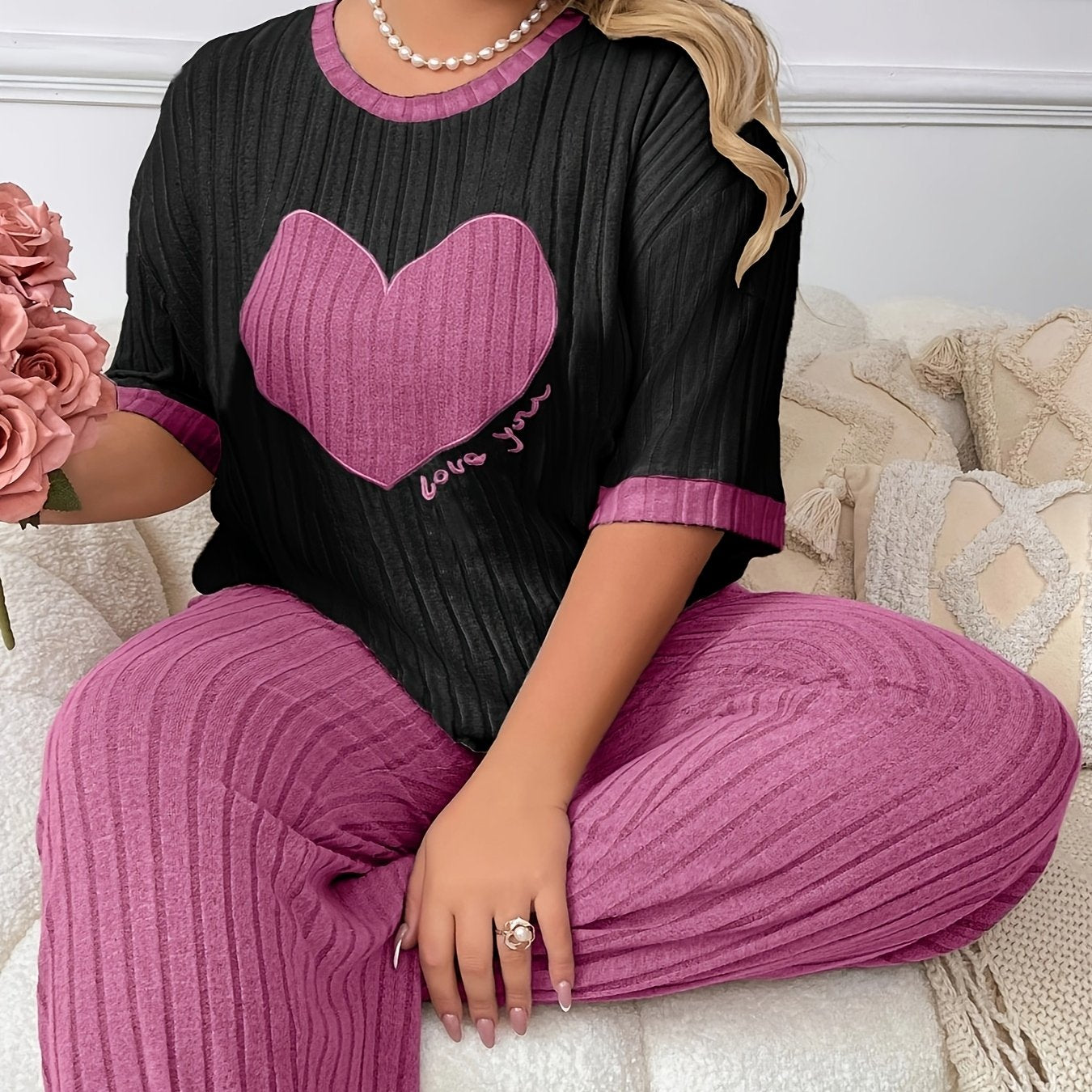 Cozy heart embroidered pajama set in plus size, includes short sleeve top and long pants made of soft polyester. Machine washable.