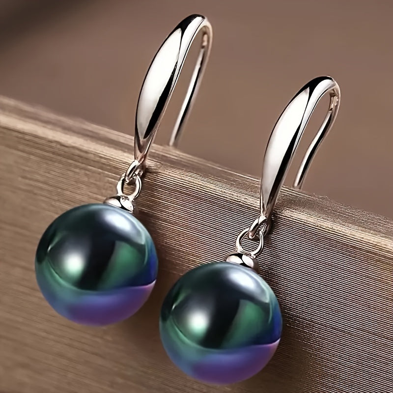 Give the gift of elegance with these stunning S925 Sterling Silver earrings featuring large natural green pearls measuring 12mm. Perfect for your daughter, girlfriend, wife, mother, or friends, these earrings are ideal for any occasion, from parties and