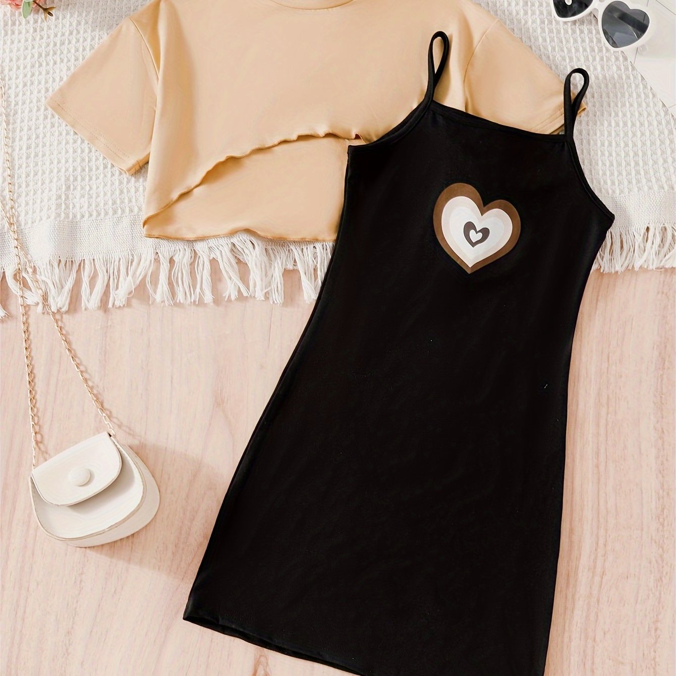 Girls 2-piece casual outfit perfect for outdoor activities, featuring a high low top and heart pattern cami dress.