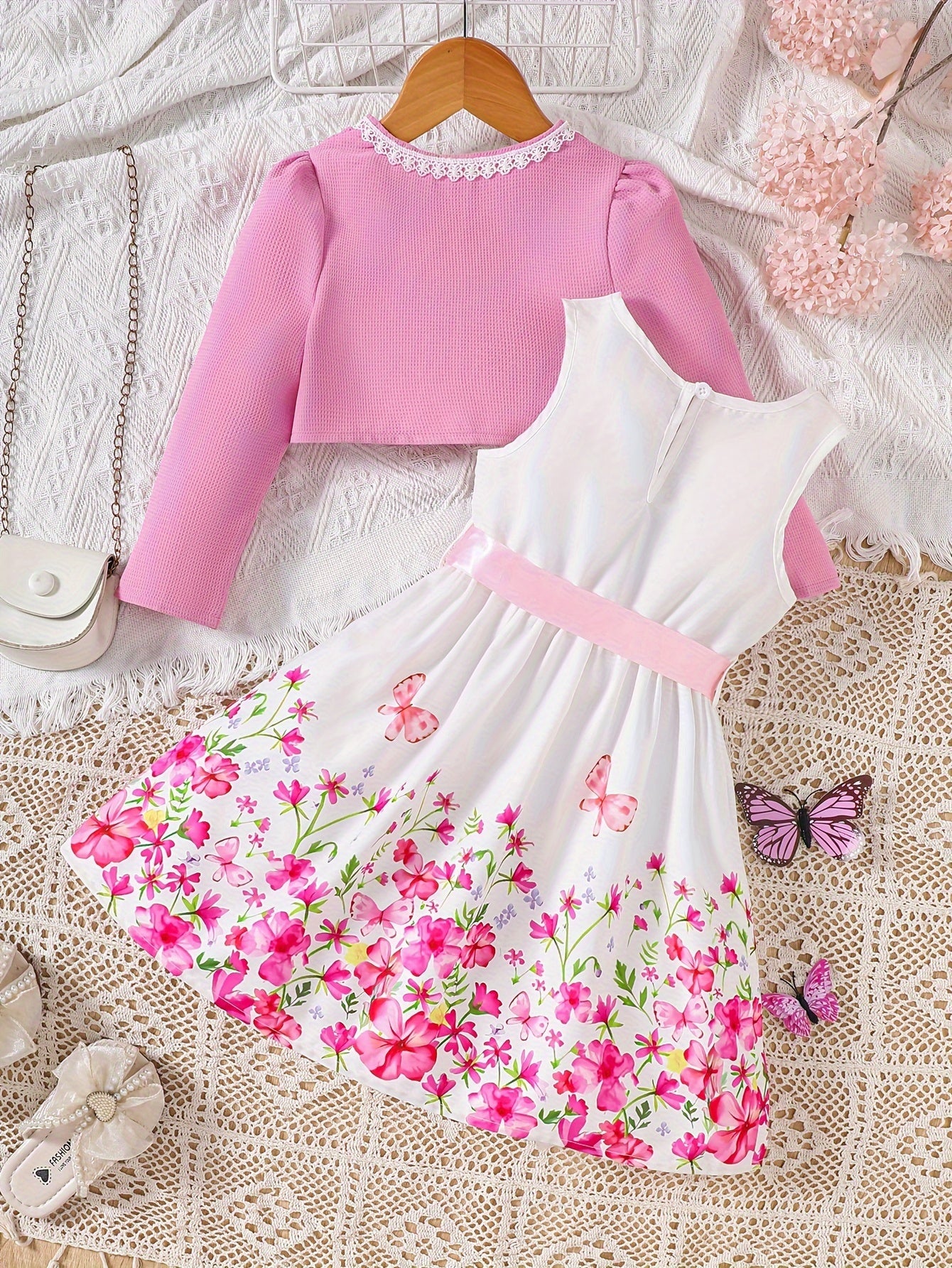 Girls' spring fashion 2-piece set includes floral print dress with belt detail and matching cardigan. Made of 100% polyester, non-stretch woven fabric. Perfect for outdoor wear.