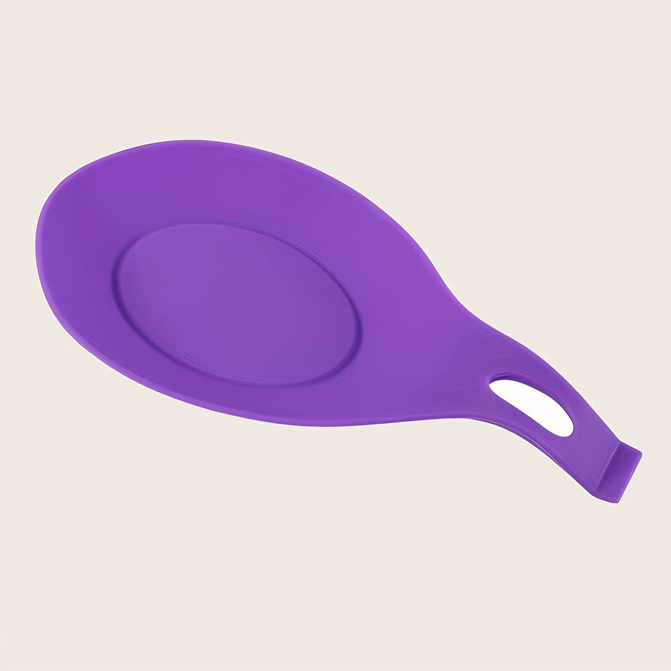 Durable, non-slip silicone spoon pad for kitchen utensils, heat-resistant and easy to clean.