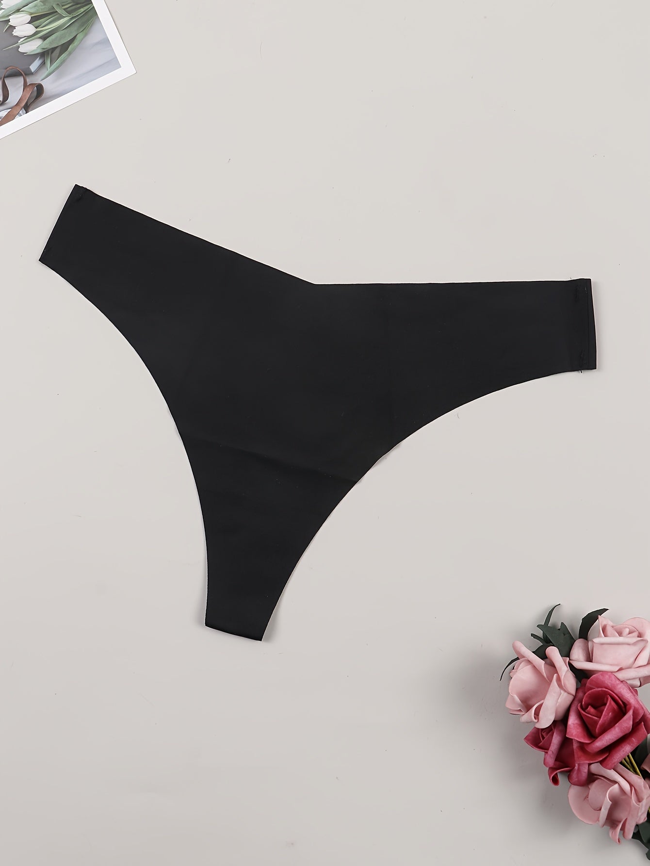 Solid black low waist thongs for women, sexy lingerie and underwear.