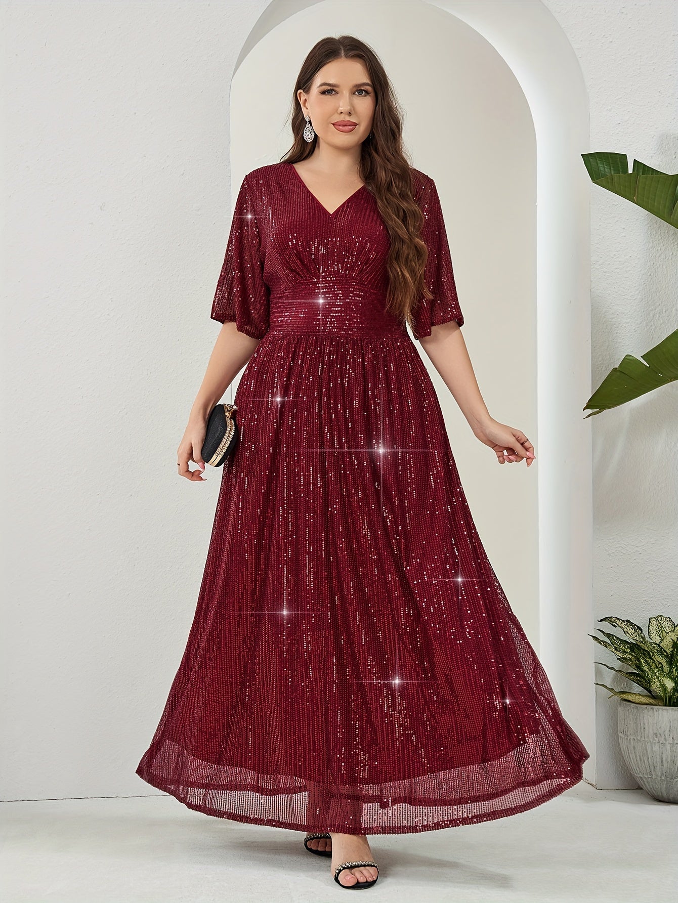 Elegant plus-size sequin maxi dress with v-neck and half sleeves. Made of non-sheer polyester with zip detail. Suitable for all seasons.