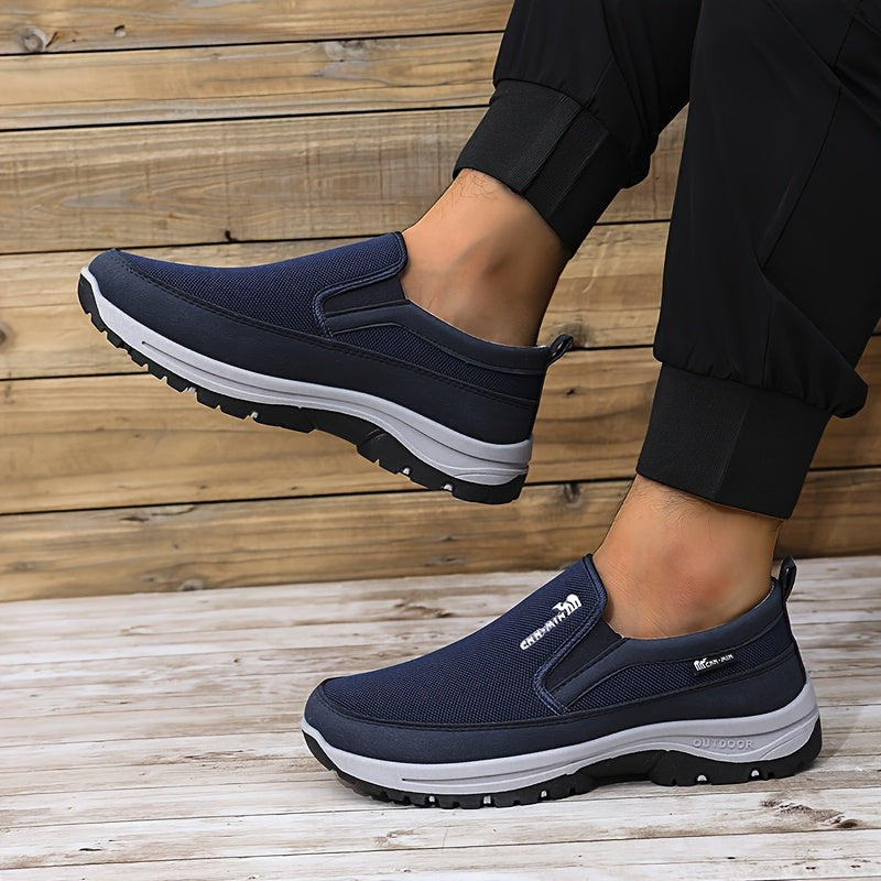 Men's slip-on sports sneakers with breathable fabric upper, round toe, and faux sole for daily wear and running.