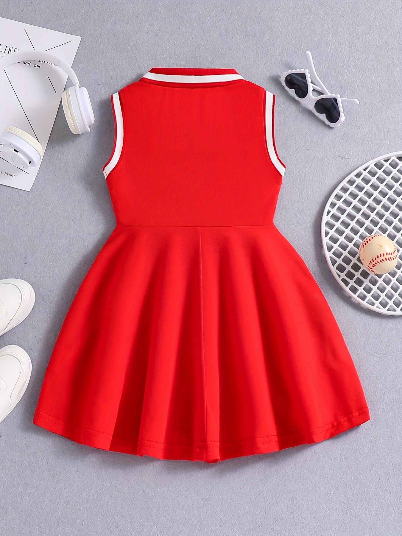 Girls' Red Tennis & Athletic Dress in sporty elegance featuring breathable, sweat-absorbent polyester with stretch and sleeveless design with black lettering for sports and casual wear.