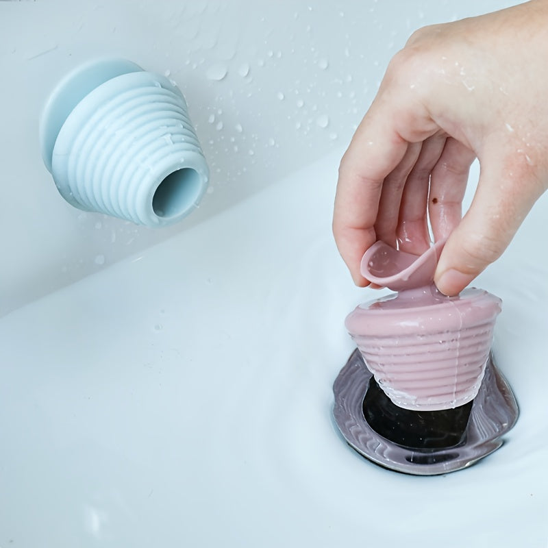 Universal silicone rubber plug with suction cup for kitchen, bathroom, and household drains.