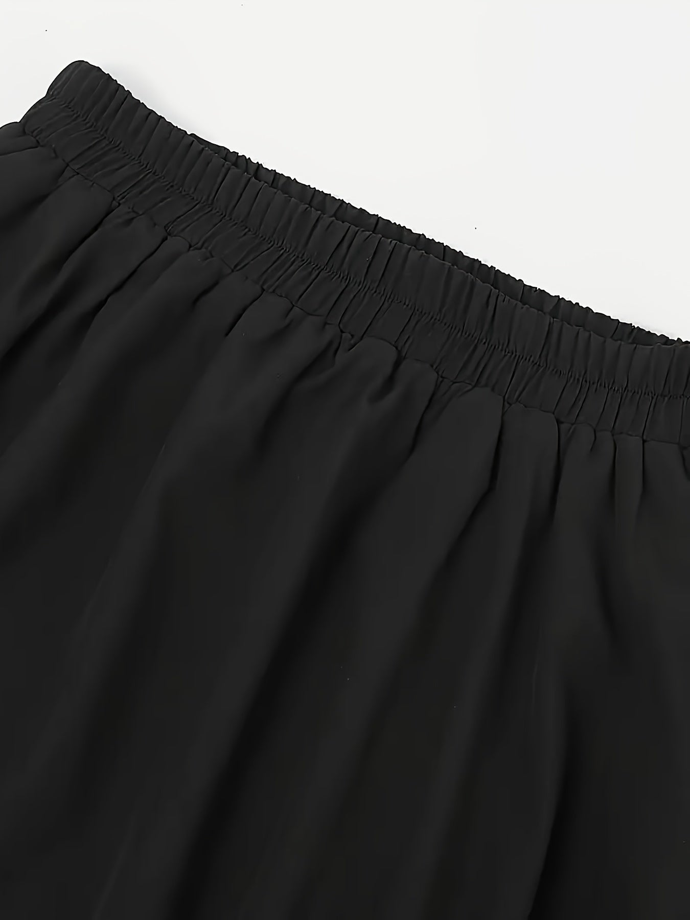 Elegant black double-tiered swing skirt made of polyester with scalloped edges. Perfect for medieval dance and Victorian performances. All-season fashion for women.