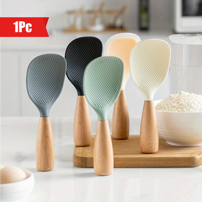 Silicone spoon with wooden handle, ideal for nonstick pans, rice cookers, and various cooking needs in home kitchens, school dormitories, and more.