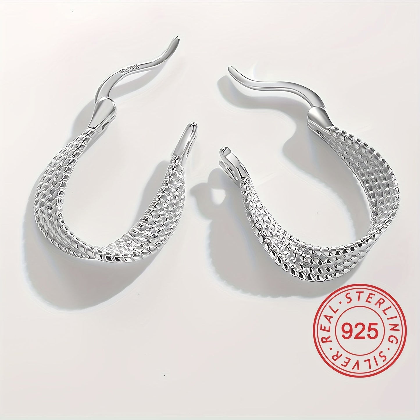 Classic and elegant, these twisted design hoop earrings are made of S925 sterling silver, making them hypoallergenic and perfect for sensitive ears. A timeless and exquisite gift for any woman.