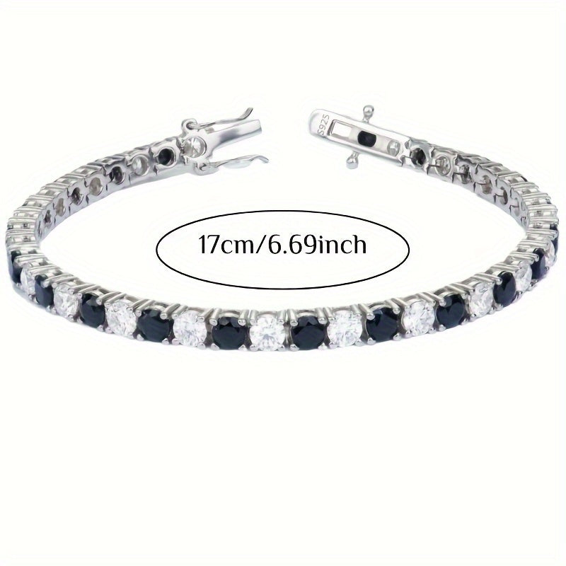 Tennis bracelet made of S925 sterling silver and plated with 18K gold, set with synthetic Moissanite stones in a 4mm two-tone black and white design. Featuring December birthstone, perfect for a sexy vacation style or music festival party. An ideal