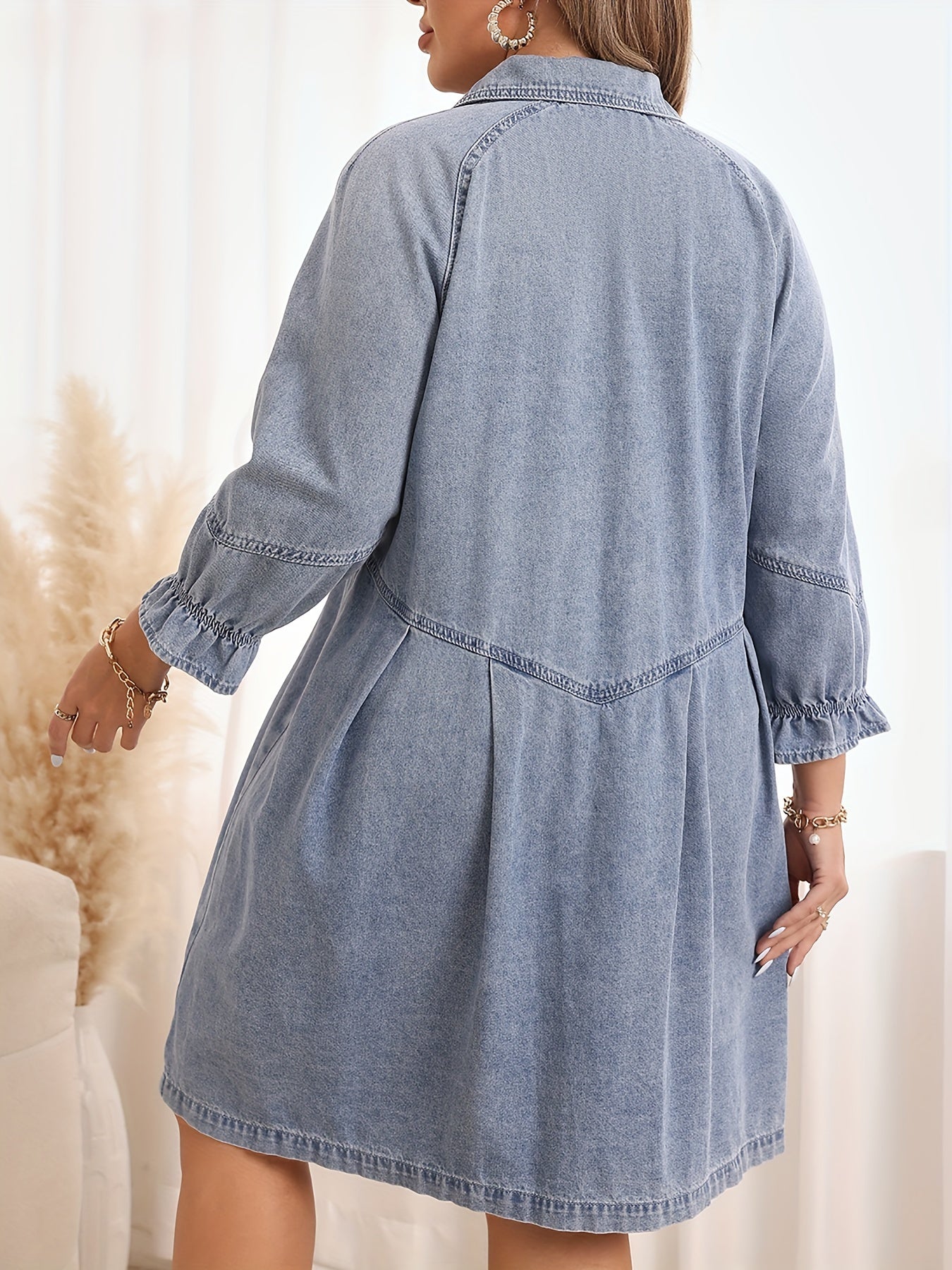 Casual denim shirt dress with ruffle hem in light blue for plus size women.