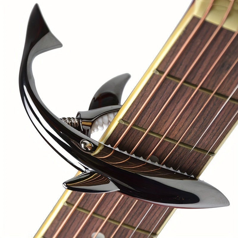 Stylish zinc alloy capo for acoustic and electric guitars, changes pitch.