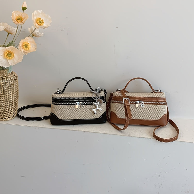 Retro-inspired mini crossbody bag for women in colorblock design, with adjustable strap and zip closure in black/blue/dark red/light brown/orange.