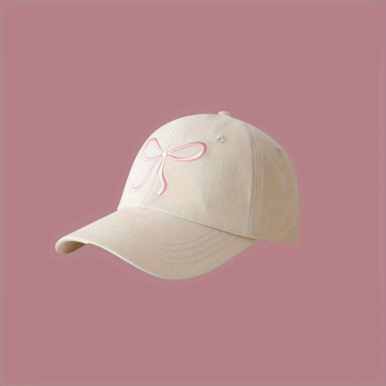 Adjustable bowknot baseball cap in sweet pink design, made of lightweight polyester. Comes in black, grey, apricot, and pink for casual wear.