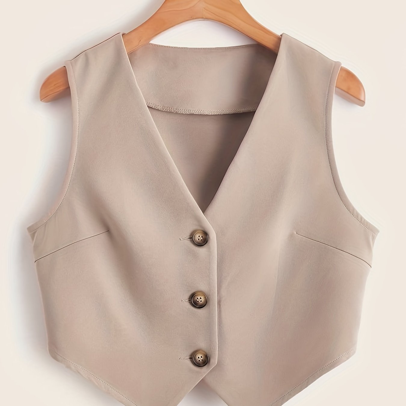 Sleeveless button-front vest with V-neck for women's workwear.