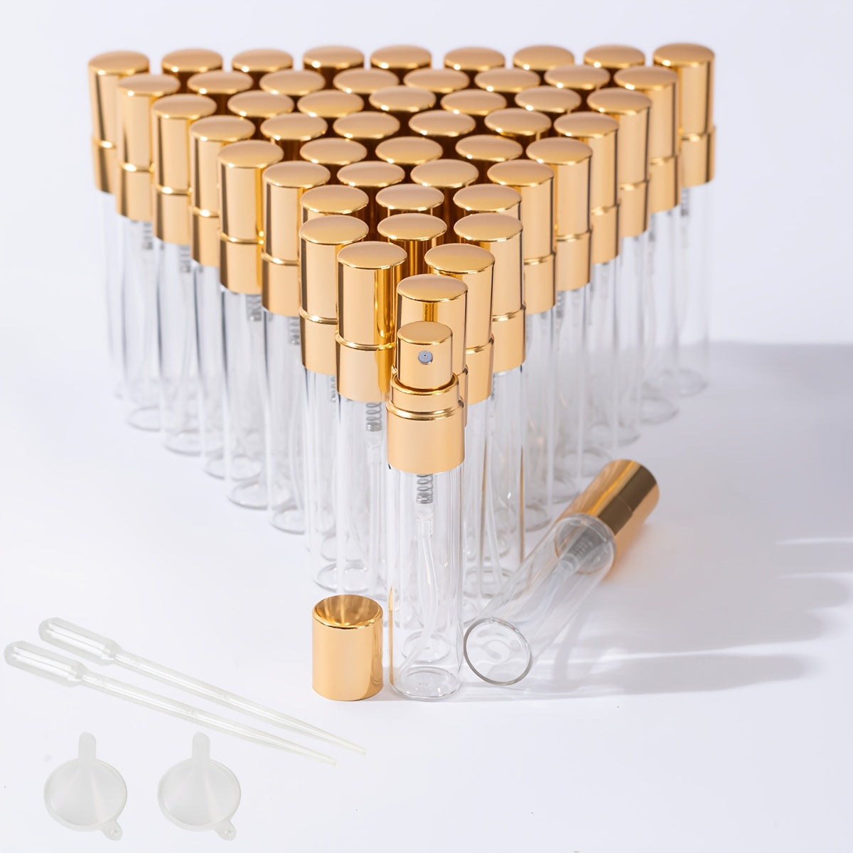 50 transparent glass bottles for decanting 5ml and 10ml perfumes, with spray tops.