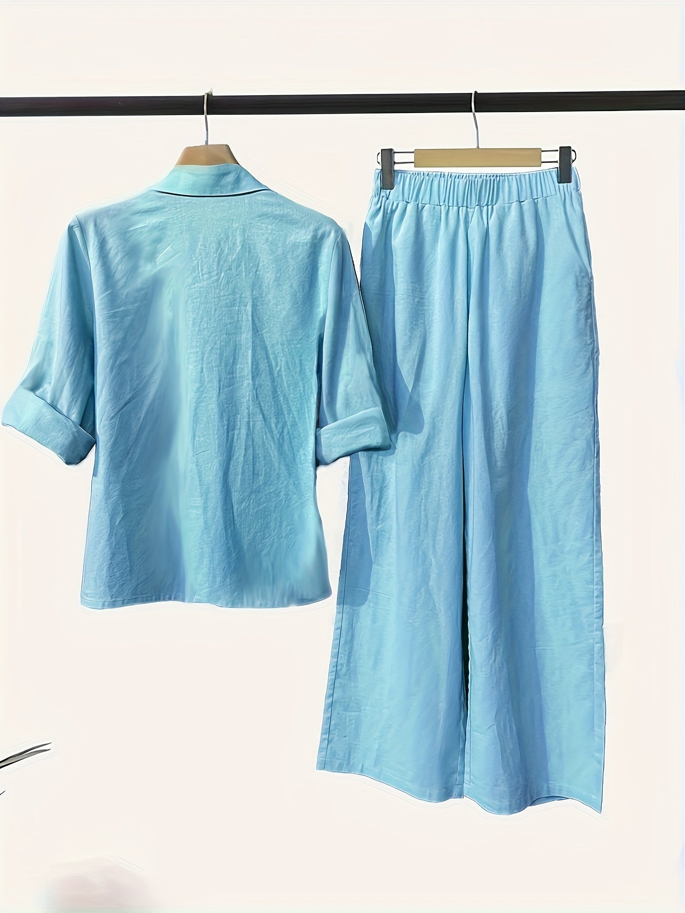 Women's casual chic two-piece set includes a long sleeve button-up shirt and wide-leg pants in a solid color. Machine washable for convenience.