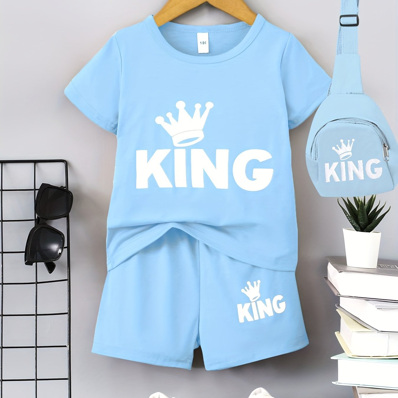 Boys' "KING" Crown Print Casual Outfit Set in Black - includes T-shirt, shorts, and crossbody bag. Made of 100% polyester, machine washable. Ideal for spring/summer, outdoor activities.