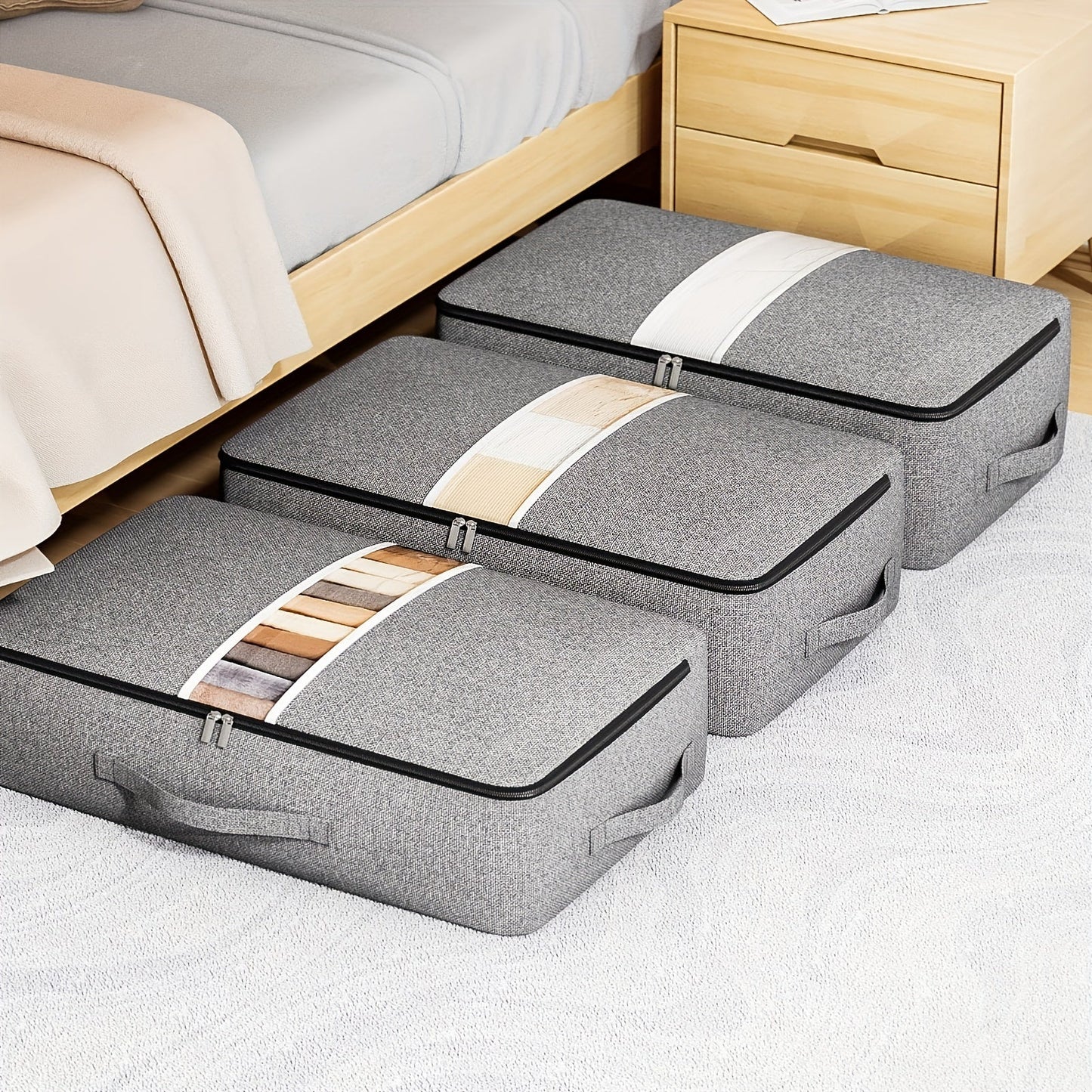 Under-bed storage bag with transparent window, handle, and generous capacity for storing clothes, quilts, and blankets.