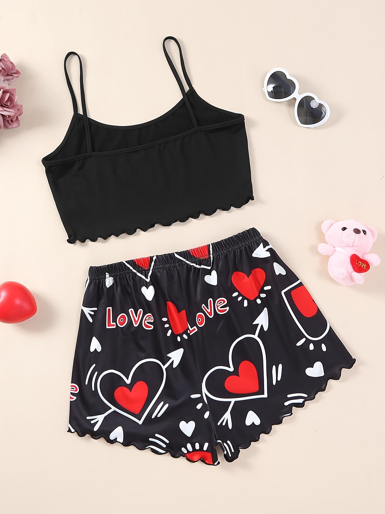 Valentine's Day pajama set for women, featuring heart and slogan print cami top with lettuce trim crew neck and elastic shorts.