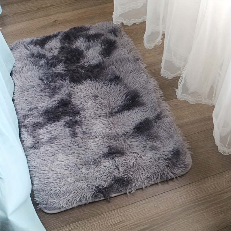 Soft and luxurious light gray plush floor mat with non-slip backing for ultimate comfort and safety. Made of ultra soft, fluffy polyester, this mat is perfect for use in the bedroom, bathroom, or living room. It is machine washable, making it easy to