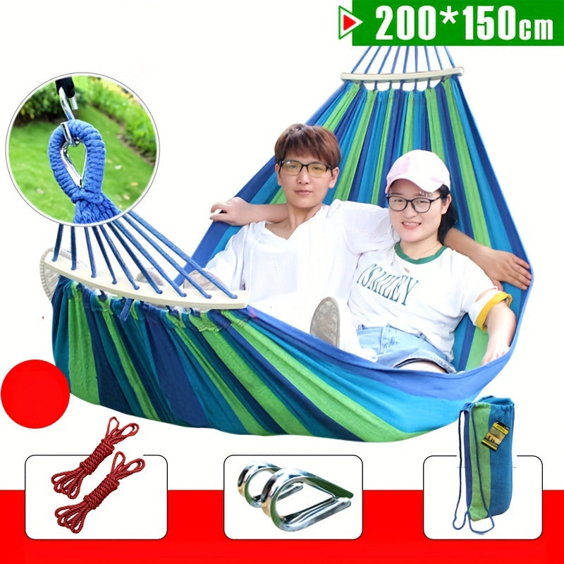 Heavy-duty rainbow canvas hammock for single or double with curved wooden sticks and a weight capacity of 226.8 KG. Includes tree straps for camping, backyard, or patio. High-strength