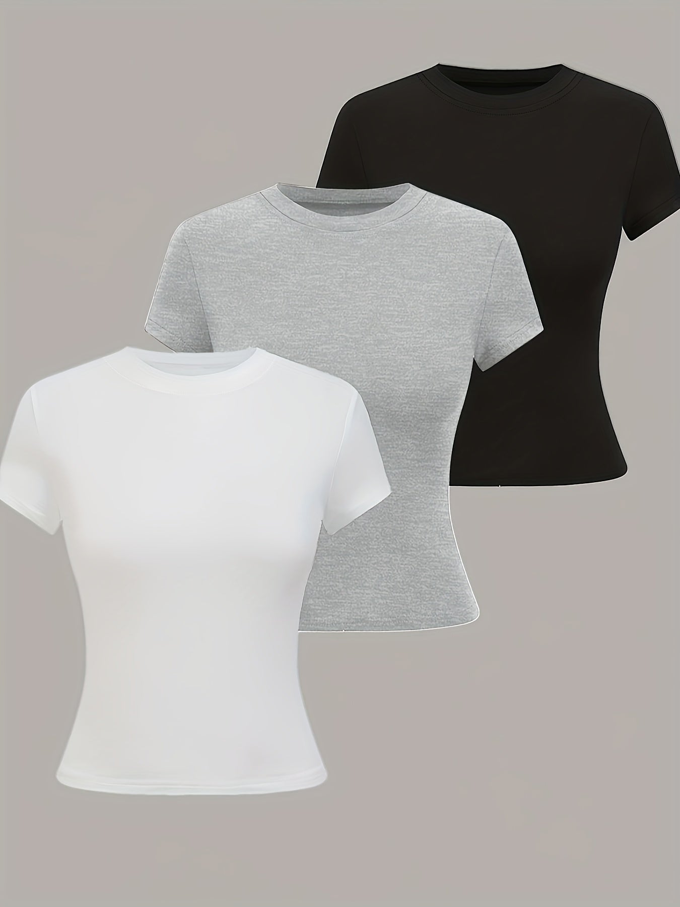 3 women's casual sports t-shirts with round neck, short sleeves, in solid colors made of breathable polyester knit fabric. Perfect for summer, casual wear with a comfortable fit. Machine