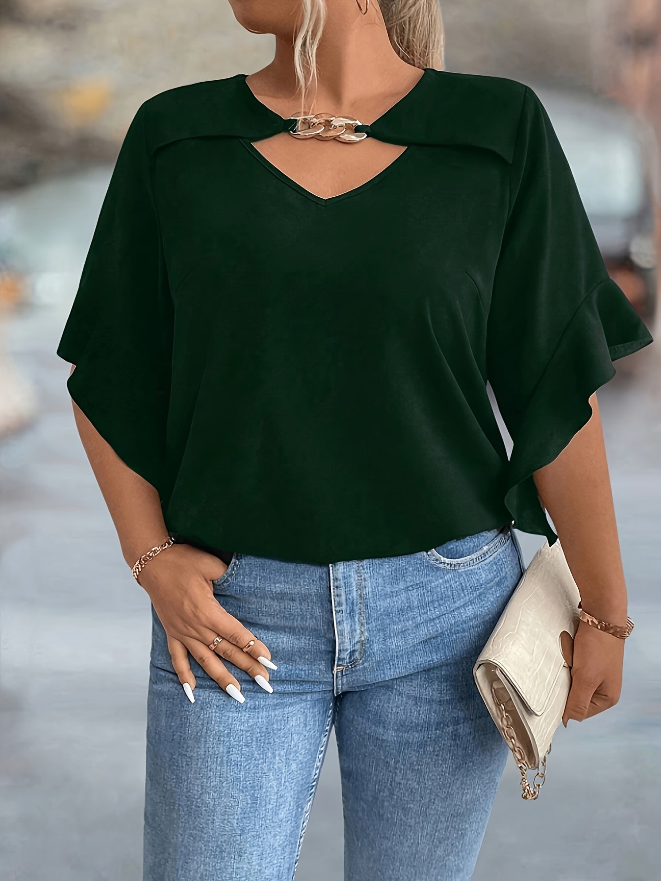 Stylish black V-neck tops for plus-size women in new summer collection.