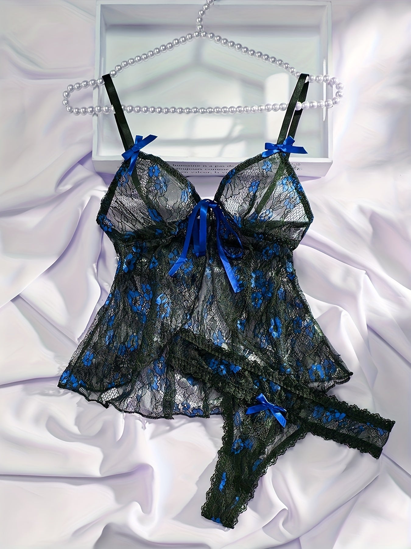 Bow tie floral lace lingerie set including a semi-sheer bra and panties for women's sexy underwear.