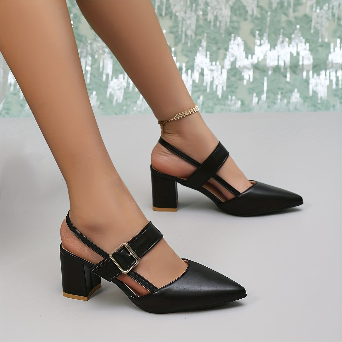 Women's black block heel sandals with pointed toe, slip-on style, and faux sole. Made from man-made materials, suitable for all-season fall footwear.