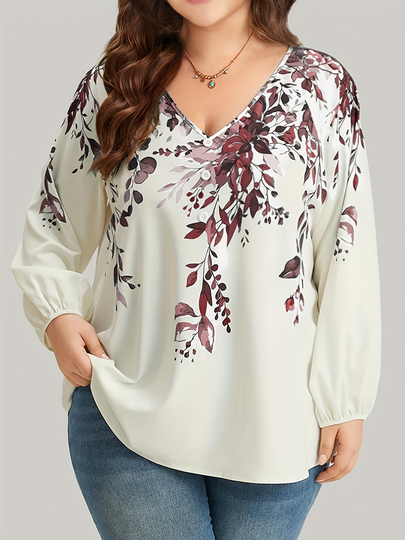 Floral print plus size blouse with V neck and long sleeves for spring. Women's plus size clothing.