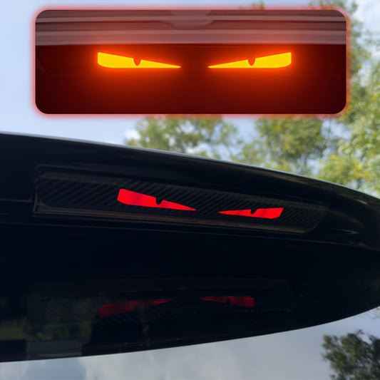 Monster Eyes Car Rear Light Sticker features Cartoon Devil Eyes Tail Light Decal with Carbon Fiber Pattern and Transparent Night Projection. It is a fun horror themed, self-adhesive sticker